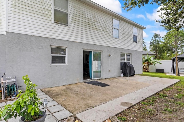 rear view of house featuring a patio