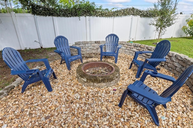 5 Buffalo Grove Pl, Palm Coast, FL 32137 - fenced backyard with a fire pit