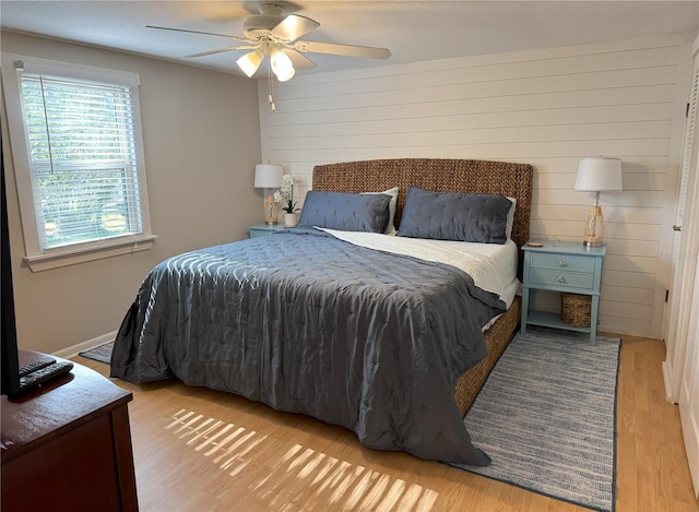 bedroom featuring a ceiling fan and wood finished floors