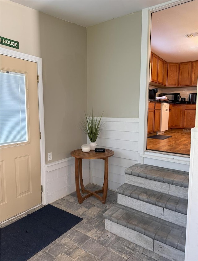 property entrance featuring visible vents