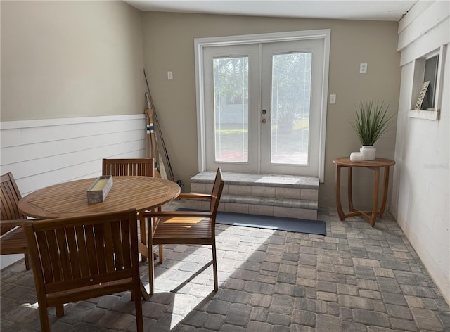 dining room with brick floor and french doors