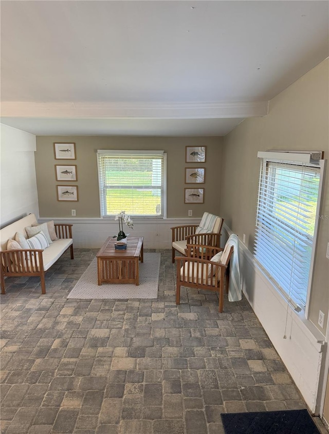 living room with brick floor