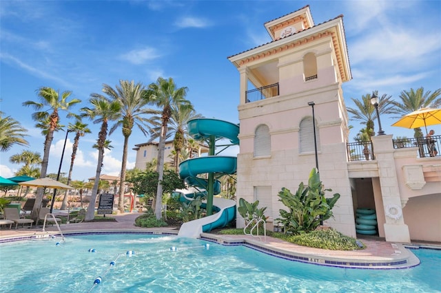 view of pool with a water slide