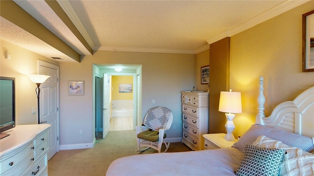 bedroom with a textured ceiling, crown molding, ensuite bathroom, and light colored carpet