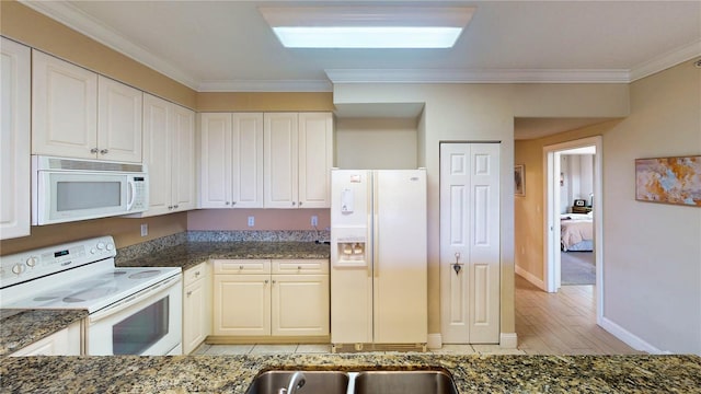 kitchen featuring light hardwood / wood-style flooring, white appliances, white cabinetry, and crown molding