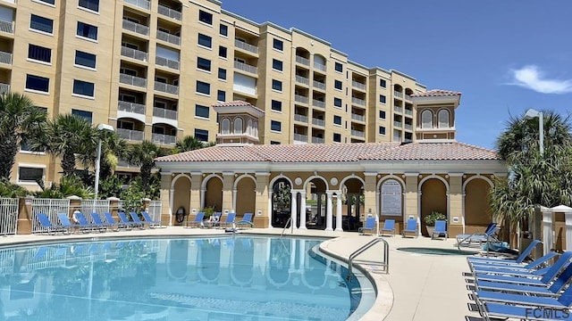 view of pool featuring a patio