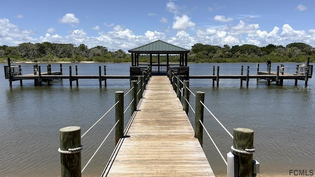 dock area featuring a gazebo and a water view