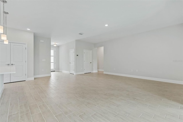 unfurnished living room featuring light hardwood / wood-style flooring