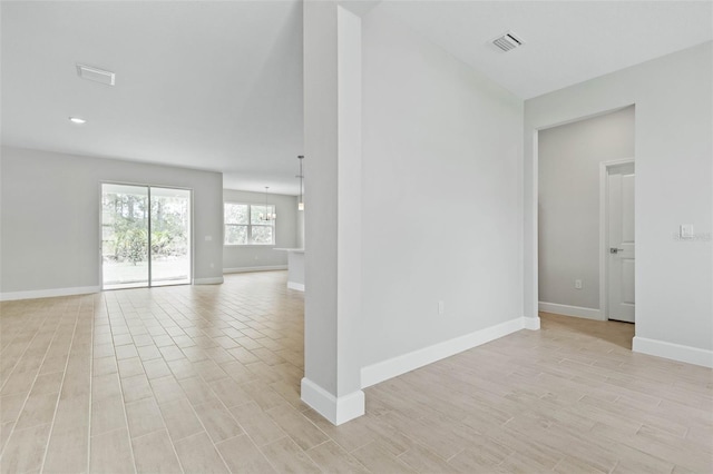 spare room featuring light hardwood / wood-style floors