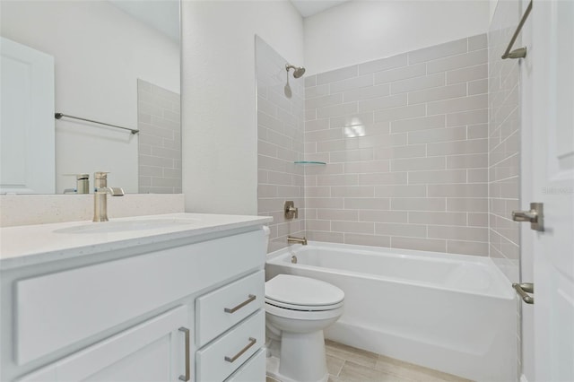 full bathroom with wood-type flooring, tiled shower / bath, vanity, and toilet