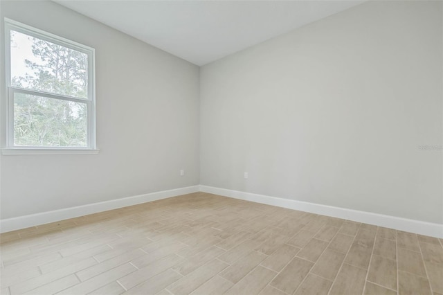 spare room featuring light hardwood / wood-style floors