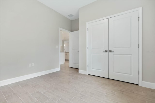 unfurnished bedroom with a closet