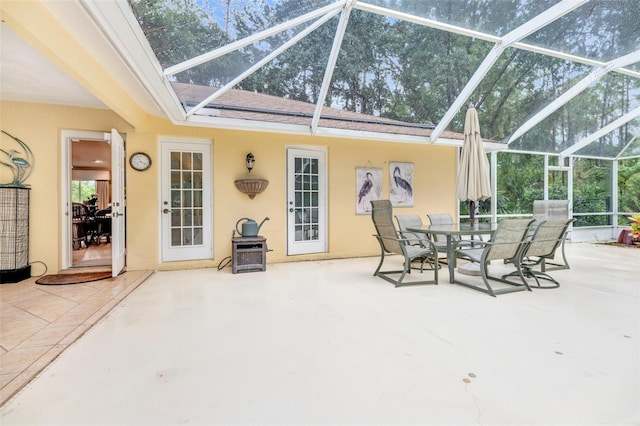 view of patio / terrace featuring glass enclosure