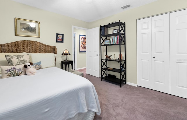 carpeted bedroom with a closet