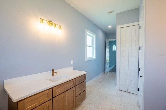 72 Flemingwood Ln, Palm Coast, FL 32137 - bathroom featuring baseboards, vanity, and recessed lighting