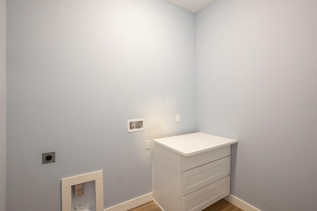 72 Flemingwood Ln, Palm Coast, FL 32137 - laundry area featuring hookup for an electric dryer, hookup for a washing machine, light wood-style flooring, and baseboards