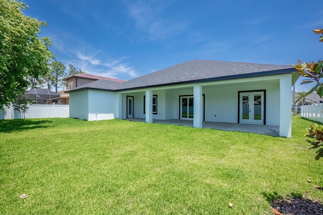 72 Flemingwood Ln, Palm Coast, FL 32137 - back of property with french doors, stucco siding, roof with shingles, and a patio area