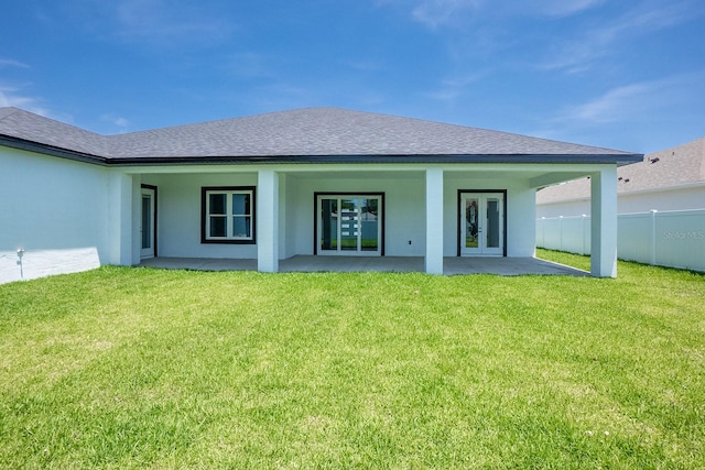 72 Flemingwood Ln, Palm Coast, FL 32137 - back of house with french doors, a patio, a shingled roof, and stucco siding