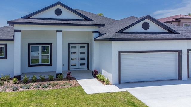 72 Flemingwood Ln, Palm Coast, FL 32137 - view of front of house featuring a shingled roof, a garage, stucco siding, concrete driveway, and covered porch