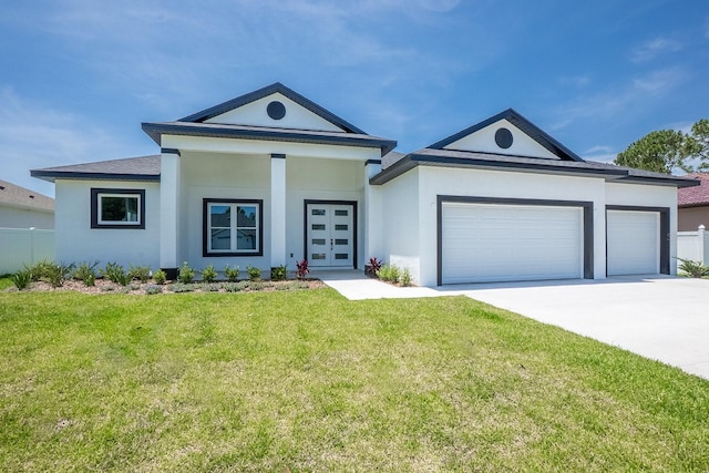 72 Flemingwood Ln, Palm Coast, FL 32137 - view of front of property featuring an attached garage, driveway, stucco siding, and french doors
