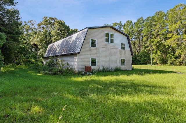 view of home's exterior with a yard