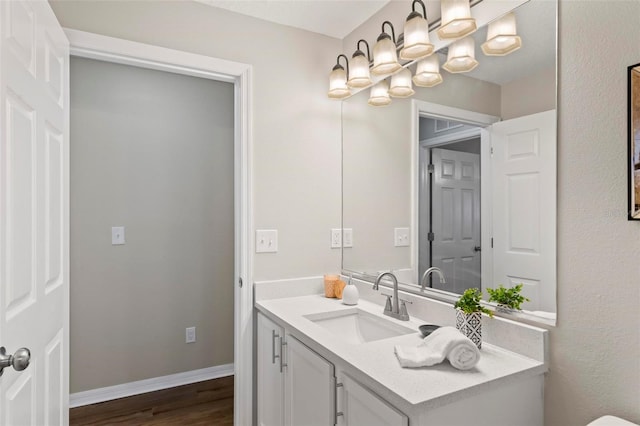 bathroom featuring wood-type flooring and vanity