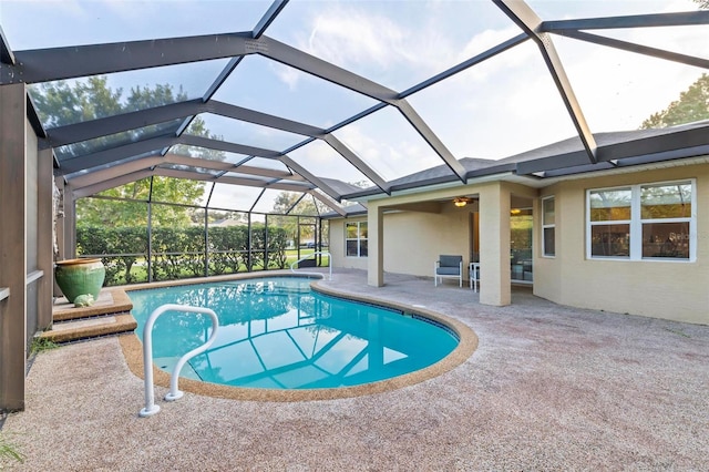 view of pool with a lanai and a patio area