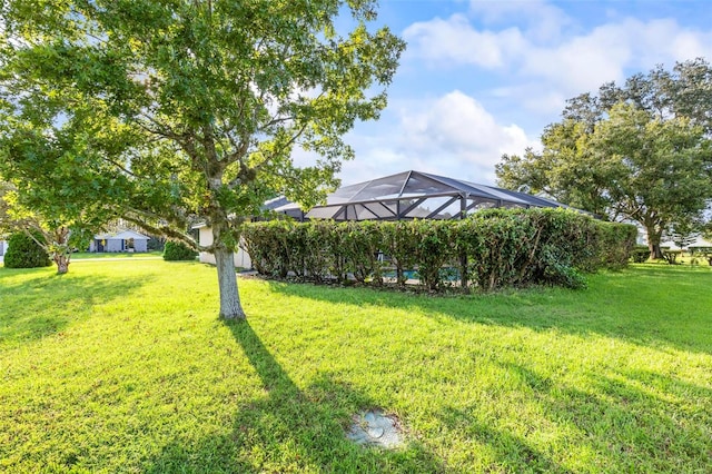 view of yard with a lanai