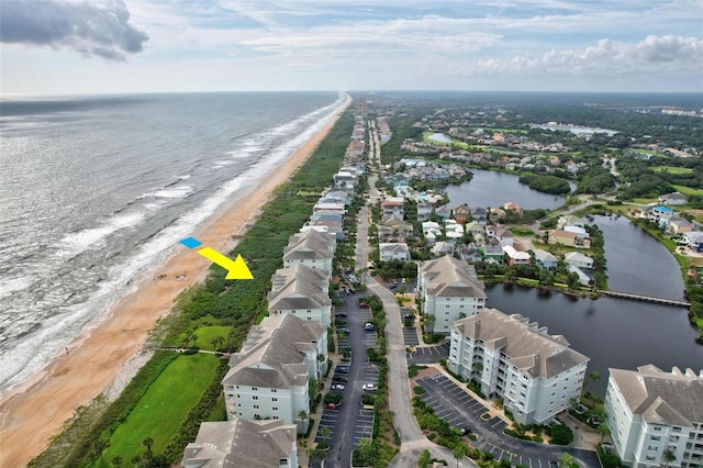 drone / aerial view with a water view and a view of the beach