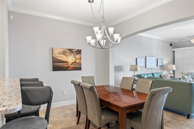 dining area with ceiling fan with notable chandelier and ornamental molding