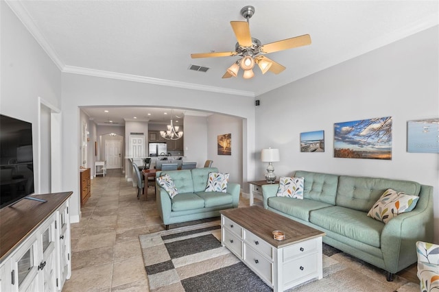 living room with ceiling fan with notable chandelier and crown molding