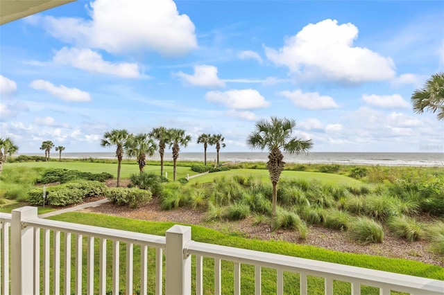 view of yard with a view of the beach and a water view