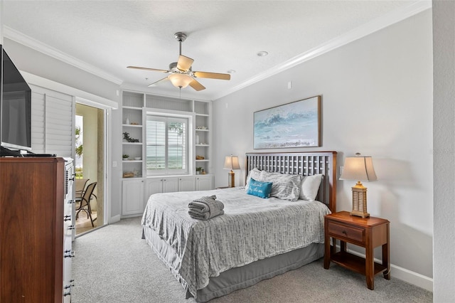 carpeted bedroom featuring crown molding and ceiling fan