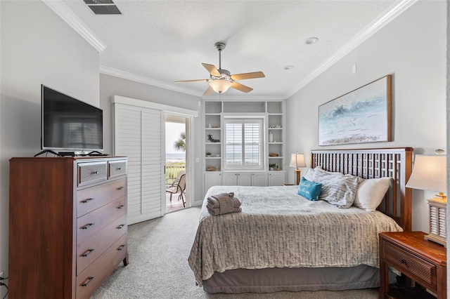 bedroom featuring a textured ceiling, access to exterior, light colored carpet, crown molding, and ceiling fan