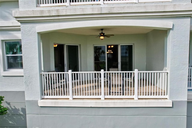 property entrance with ceiling fan