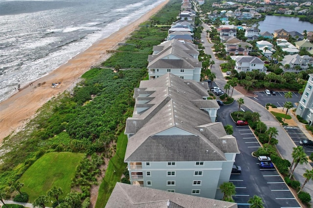 aerial view featuring a view of the beach and a water view