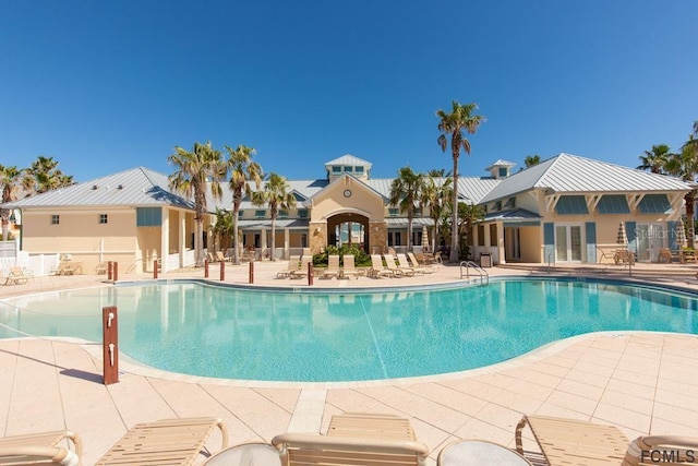 view of swimming pool featuring a patio area