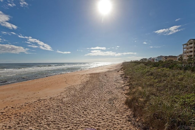 view of water feature with a beach view