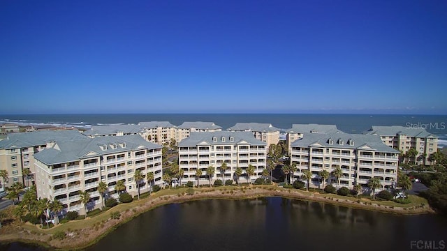 birds eye view of property featuring a water view