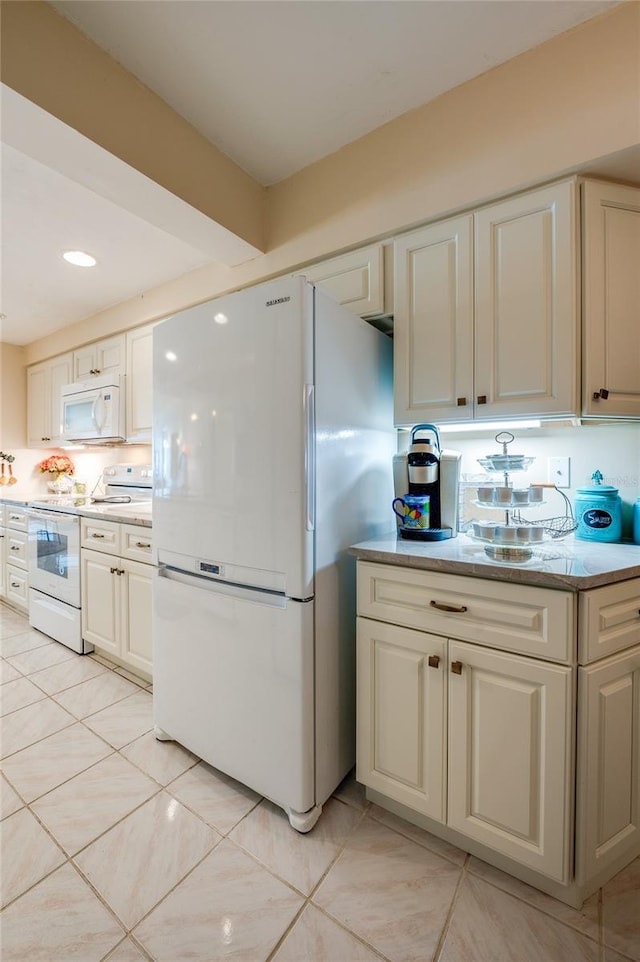 kitchen with backsplash, white appliances, and light tile patterned floors