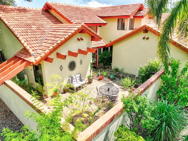 back of house with a patio