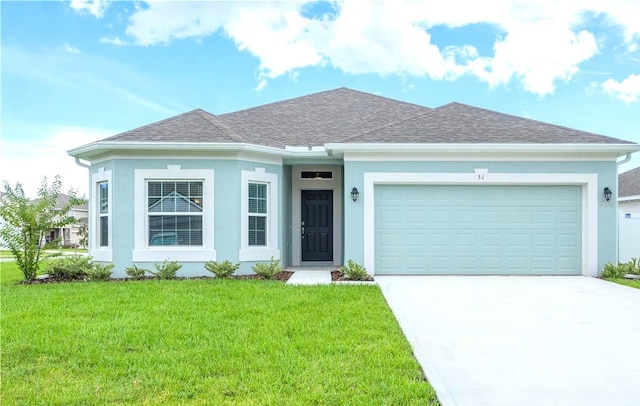 single story home with a garage and a front lawn