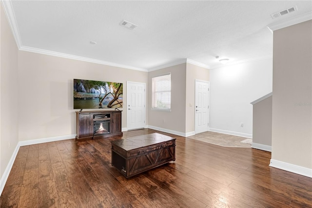 living room featuring dark hardwood / wood-style floors and ornamental molding