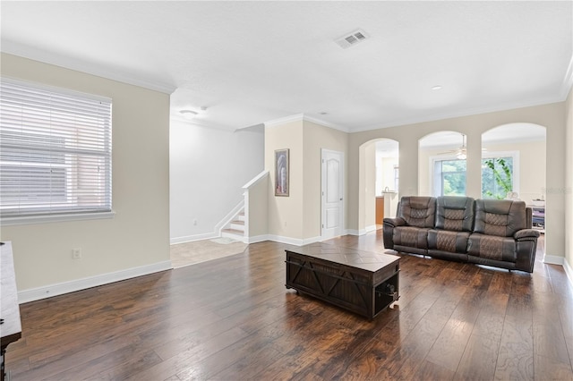 living room with ceiling fan, crown molding, and dark hardwood / wood-style flooring