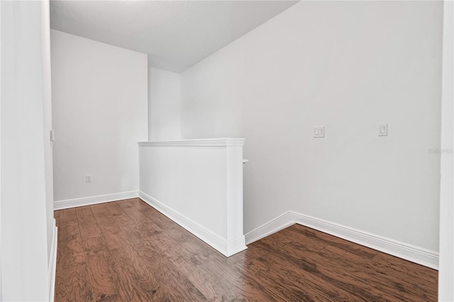 spare room featuring wood-type flooring