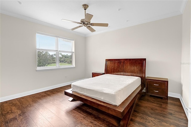 bedroom featuring ceiling fan, dark hardwood / wood-style floors, and ornamental molding