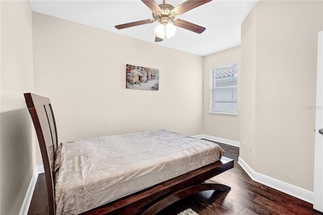 bedroom featuring ceiling fan and dark wood-type flooring