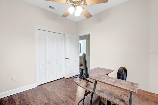 unfurnished office featuring wood-type flooring and ceiling fan