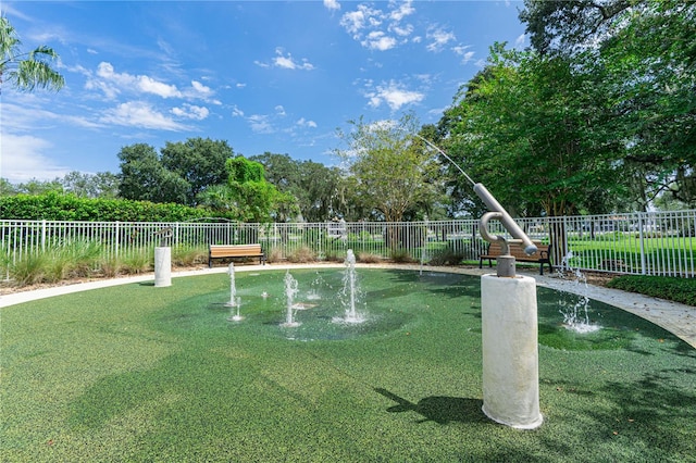 view of home's community featuring a lawn