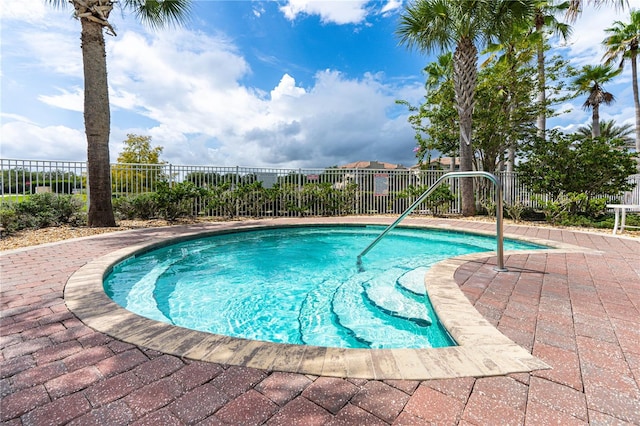 view of swimming pool with a patio area